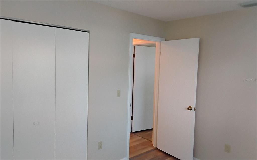 8328 Southwest 106th Place Ocala, FL 34481 - Photo 17 of 23 a view of a room with wooden floor