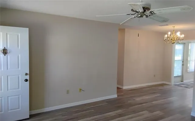 a view of a chandelier fan in a room