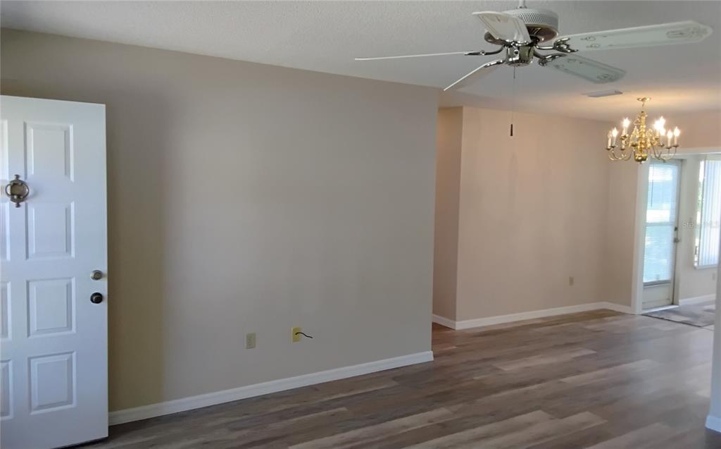 8328 Southwest 106th Place Ocala, FL 34481 - Photo 8 of 23 a view of a chandelier fan in a room