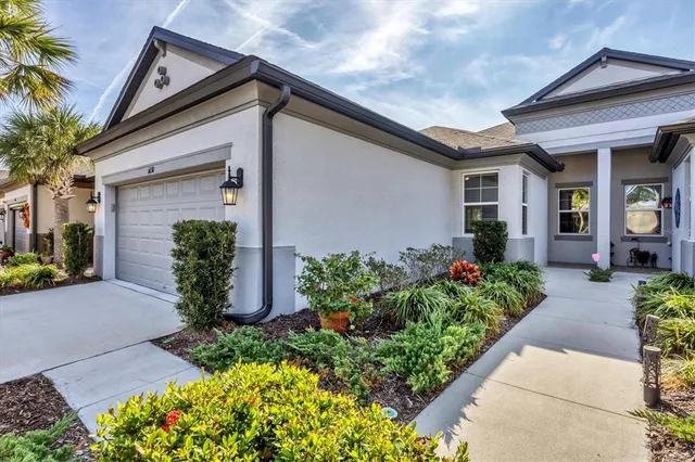 a front view of a house having garden
