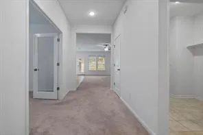 a view of a kitchen with a sink and a chandelier