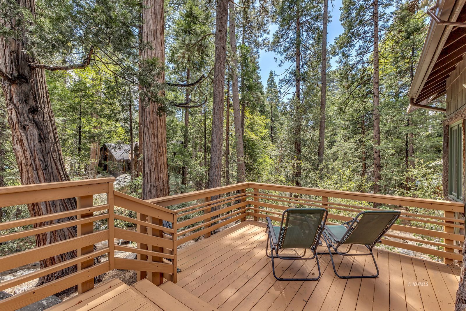 25100 Indian Rock Road Idyllwild, CA 92549 - Photo 42 of 75 a view of a chairs and table on the deck