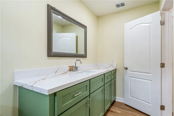 a bathroom with a sink and a mirror