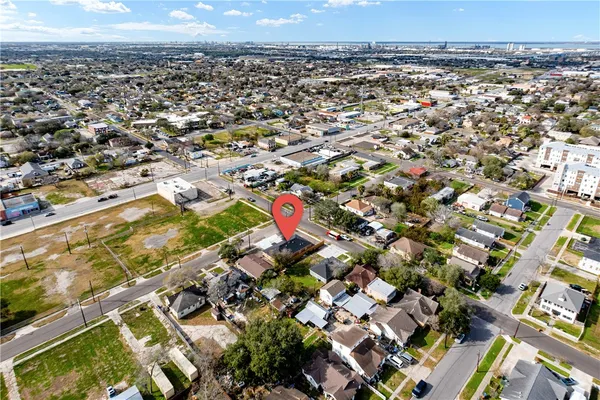 an aerial view of residential houses with outdoor space