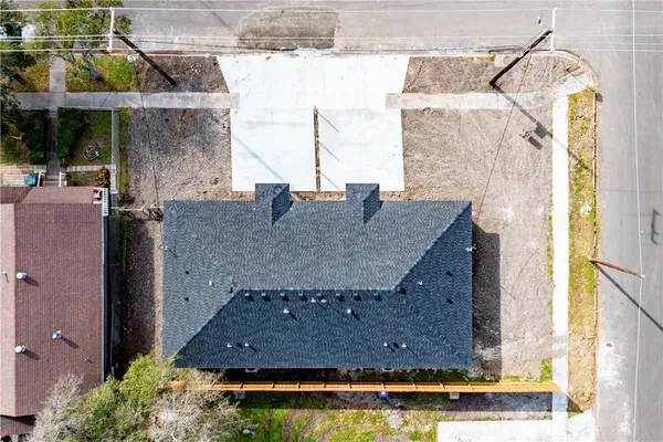 a aerial view of a house with a swimming pool