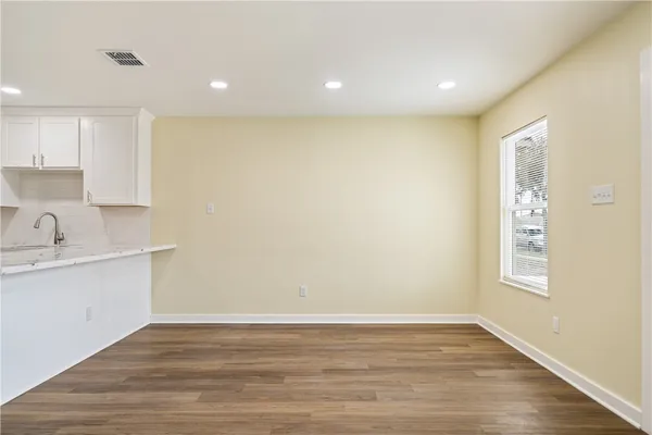 a view of a kitchen with a sink and a window