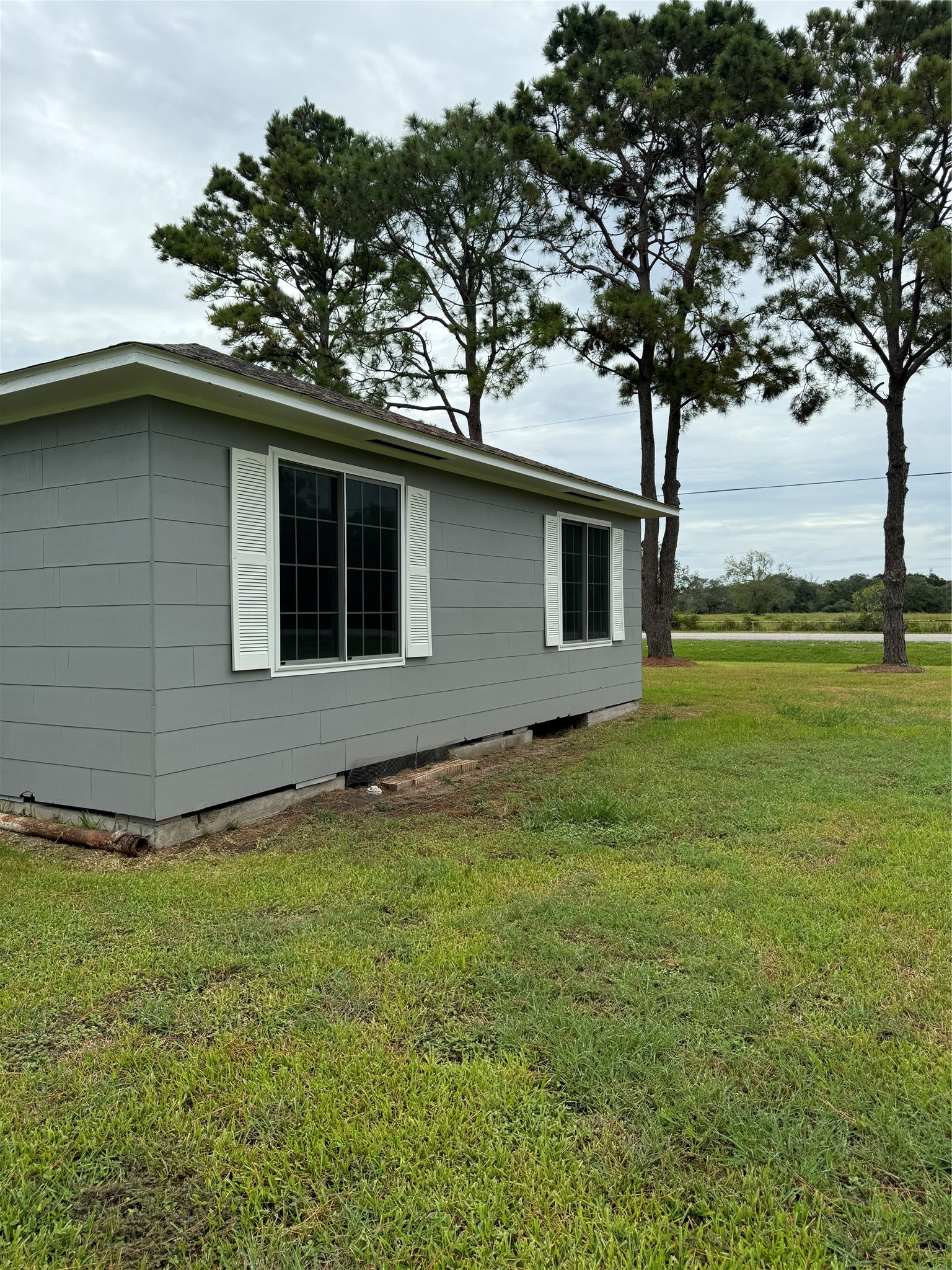 1239 Fm 1160 Road Louise, TX 77455 - Photo 16 of 24 a backyard of a house with lots of green space