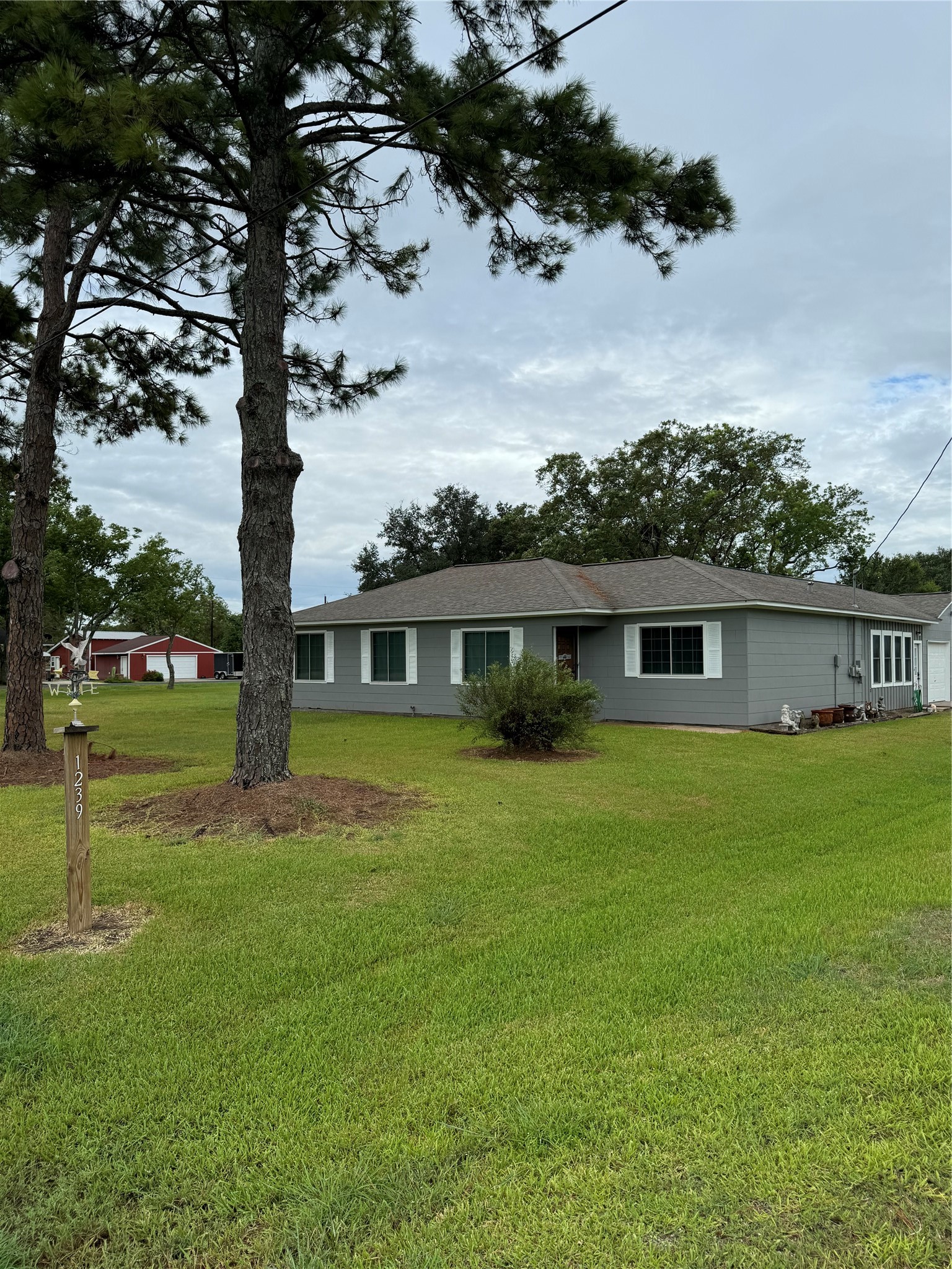 1239 Fm 1160 Road Louise, TX 77455 - Photo 2 of 24 a front view of a house with garden