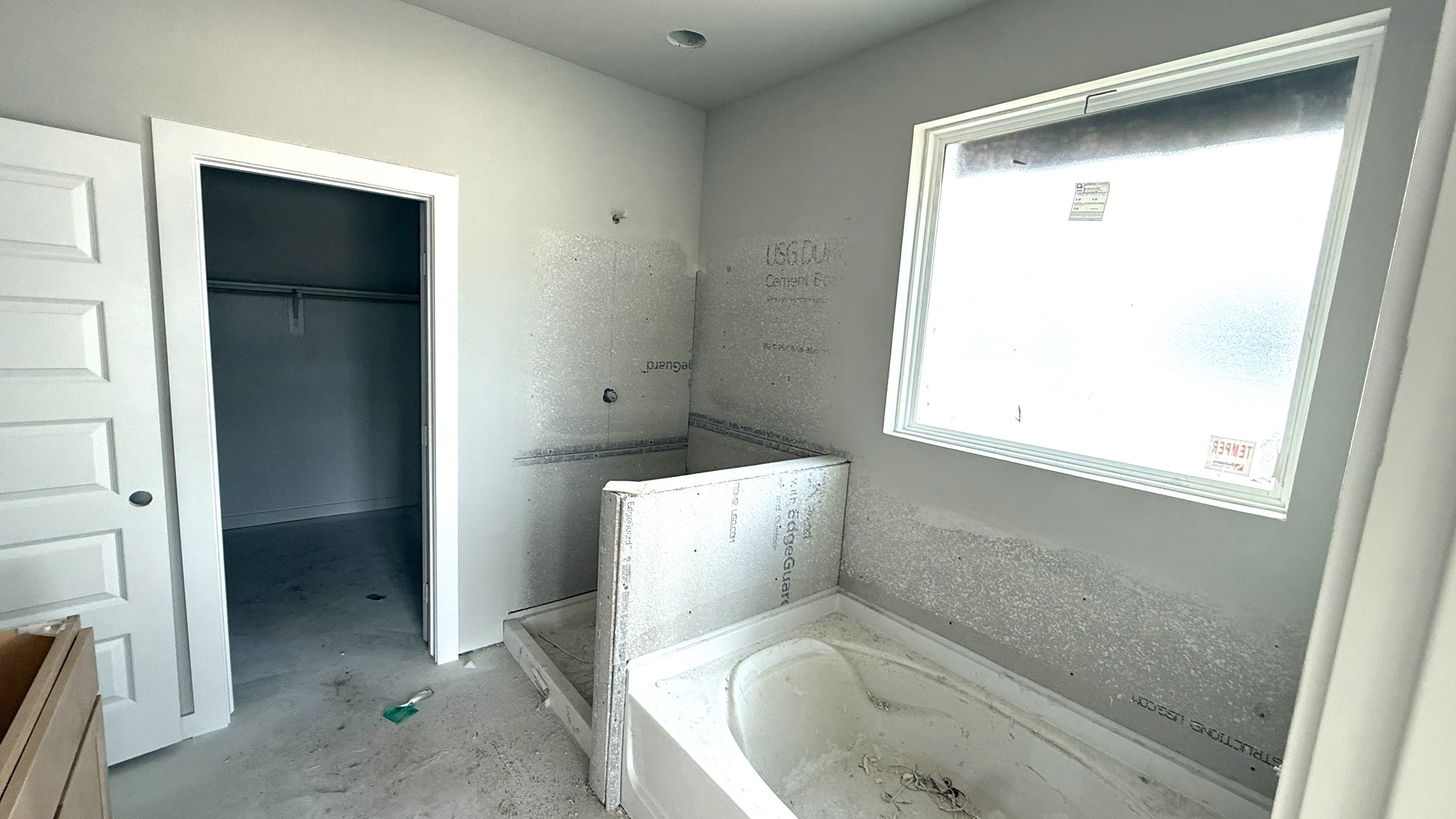 19222 Trinity Terrace Ln Spring Spring, TX 77379 - Photo 14 of 24 Enjoy the best of both worlds with a separate soaking tub for relaxation and a walk-in glass shower for convenience.