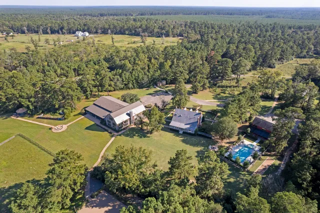 an aerial view of a house with a lake view