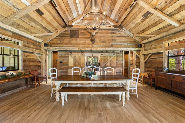 a living room with a wooden table and a table
