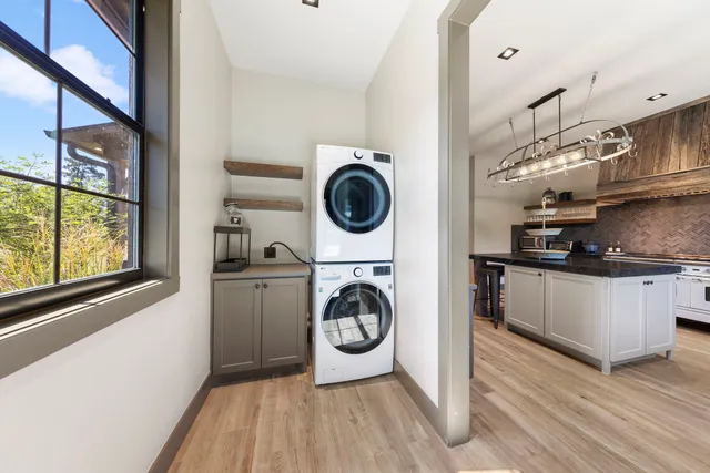 a utility room with sink dryer and washer
