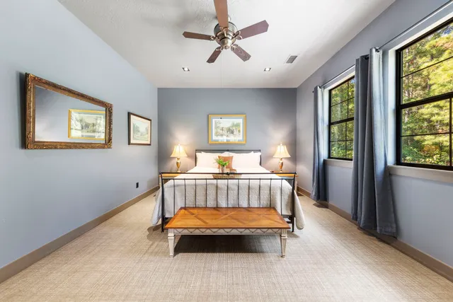 a bedroom with a bed and window