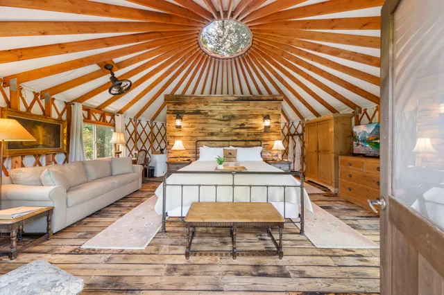 a view of living room filled with furniture and a rug