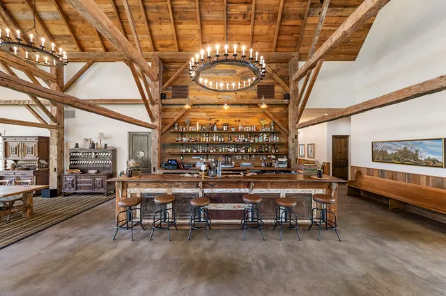 a view of a chairs and table in a room