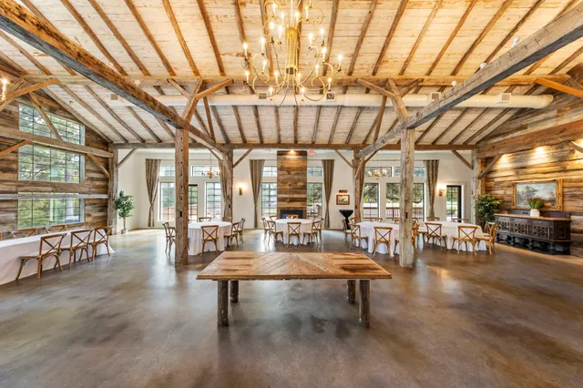 a kitchen with stainless steel appliances kitchen island granite countertop a stove and a refrigerator