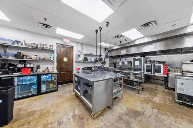 a view of a patio with a table and chairs