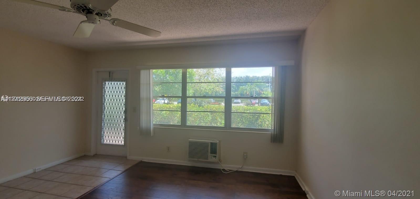 385 Fanshaw, Unit J Boca Raton, FL 33434 - Photo 3 of 7 an empty room with a window