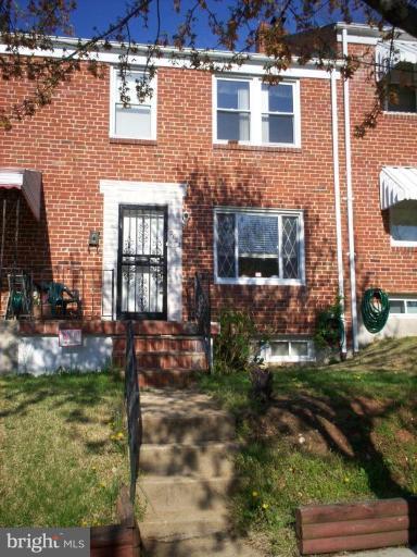 3822 Elkader Road Baltimore, MD 21218 - Photo 1 of 7 a view of a house with backyard and garden