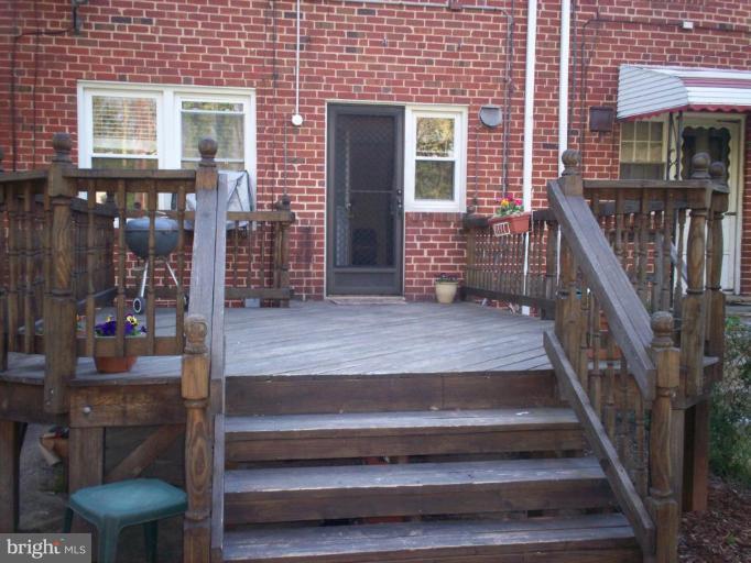 3822 Elkader Road Baltimore, MD 21218 - Photo 6 of 7 a view of front door of house with stairs