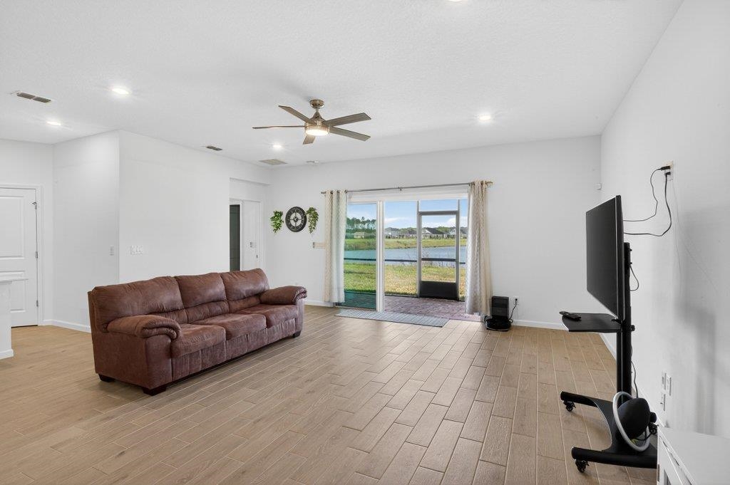 210 White Rabbit Run St. Augustine, FL 32092 - Photo 37 of 85 a living room with furniture and a flat screen tv