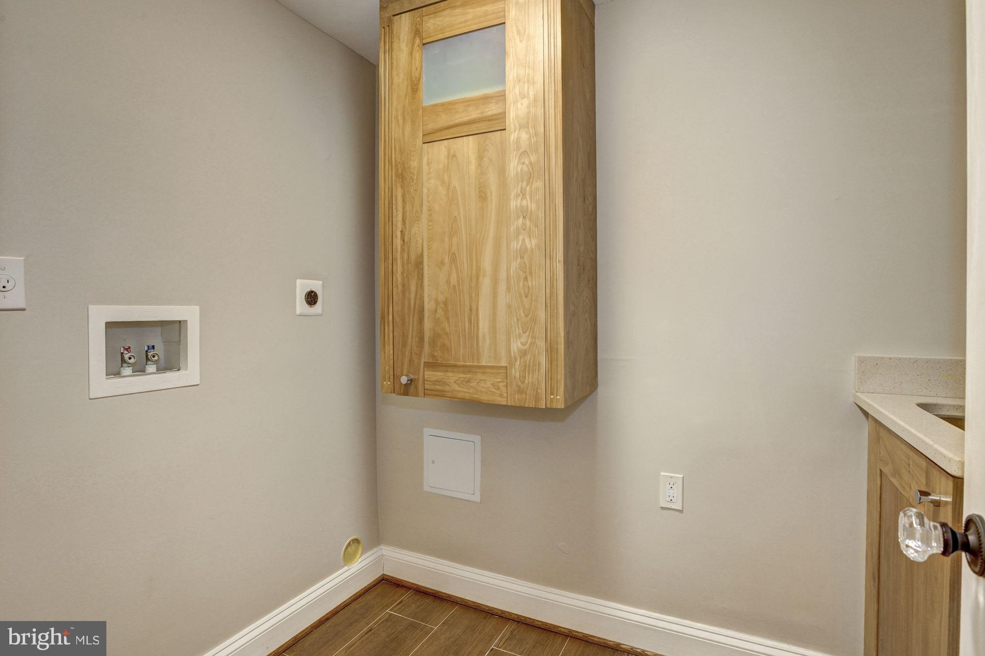 5000 Dalton Road Chevy Chase, MD 20815 - Photo 20 of 30 Laundry Room with sink and storage