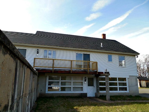 282 Palmer Road Ware, MA 01082 - Photo 24 of 27 a front view of a house with a yard