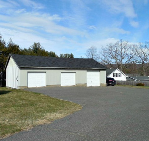 282 Palmer Road Ware, MA 01082 - Photo 4 of 27 a view of a house with a yard