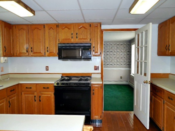 282 Palmer Road Ware, MA 01082 - Photo 10 of 27 a kitchen with a stove and a microwave