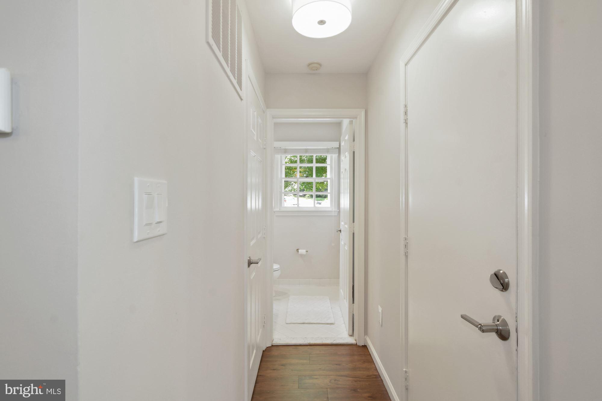 1283 Lamplighter Way Reston, VA 20194 - Photo 14 of 34 Hallway to 1-Car Garage and Powder Room