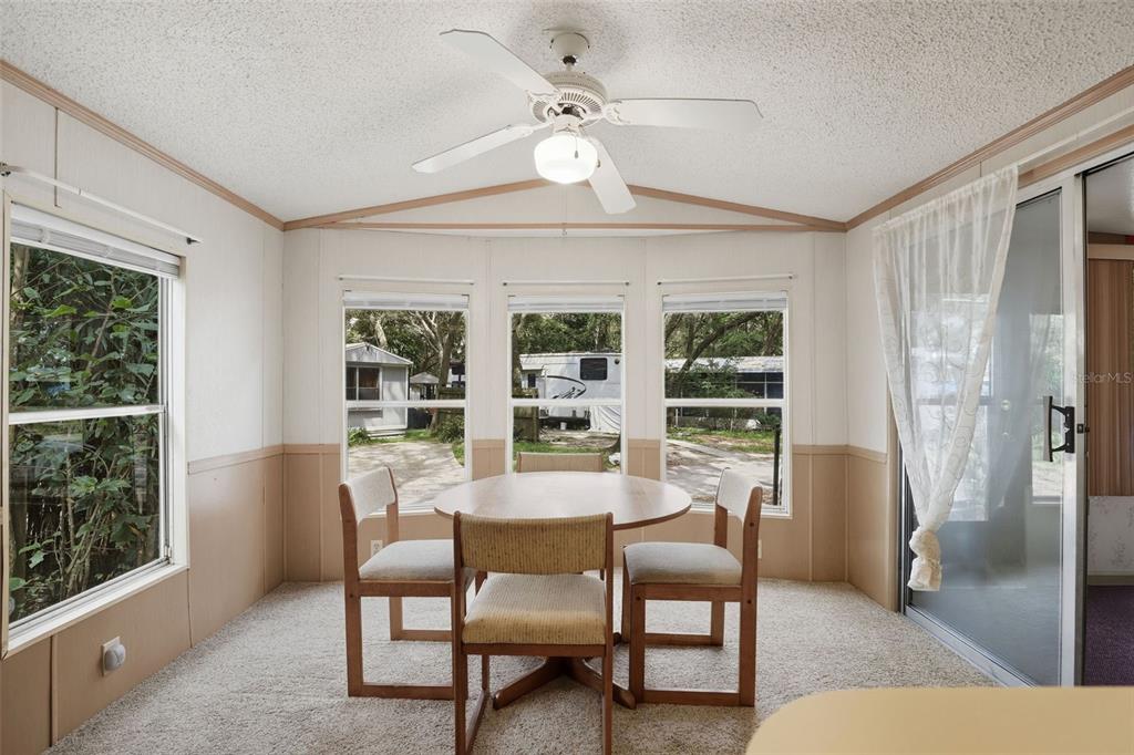 3000 Clarcona Road, Unit 362 Apopka, FL 32703 - Photo 11 of 32 a view of a livingroom with furniture and a window