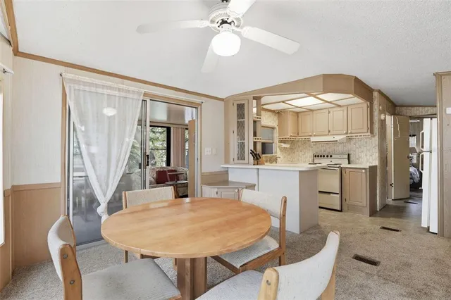 a dining room with furniture and window