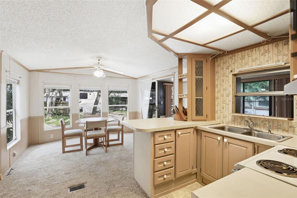 3000 Clarcona Road, Unit 362 Apopka, FL 32703 - Photo 16 of 32 a view of a kitchen with furniture and windows