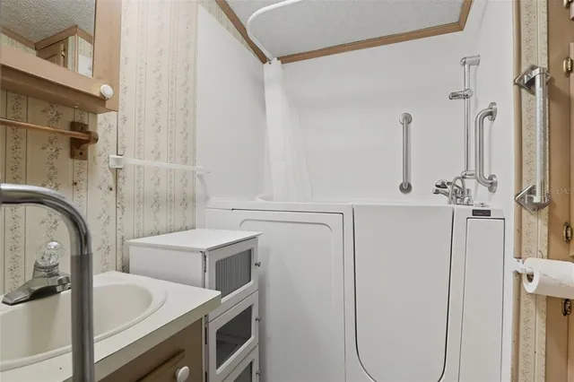 a bathroom with a sink and mirror