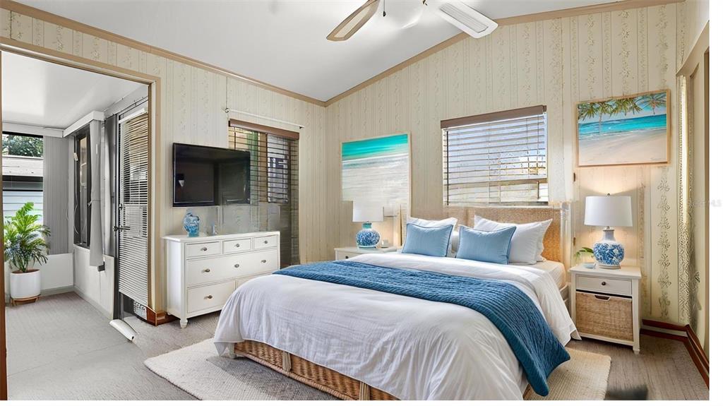 3000 Clarcona Road, Unit 362 Apopka, FL 32703 - Photo 21 of 32 a bedroom with a bed and large windows