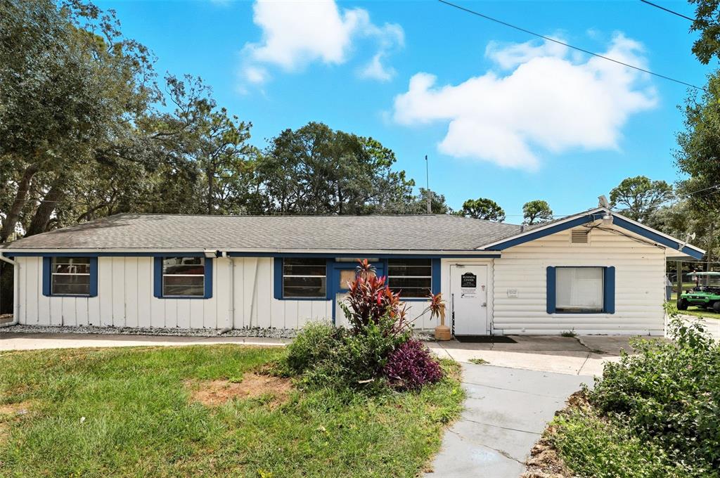 3000 Clarcona Road, Unit 362 Apopka, FL 32703 - Photo 30 of 32 a front view of house with yard and trees in the background