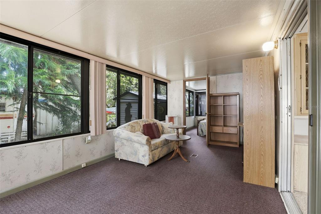 3000 Clarcona Road, Unit 362 Apopka, FL 32703 - Photo 4 of 32 a living room with furniture and a large window