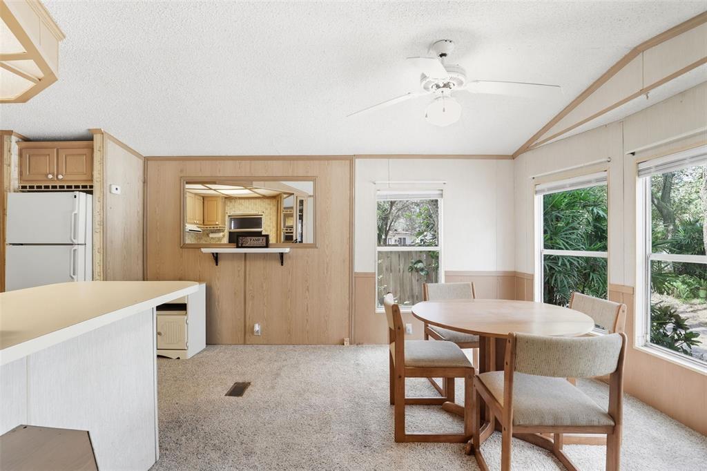 3000 Clarcona Road, Unit 362 Apopka, FL 32703 - Photo 10 of 32 a dining room with furniture and window