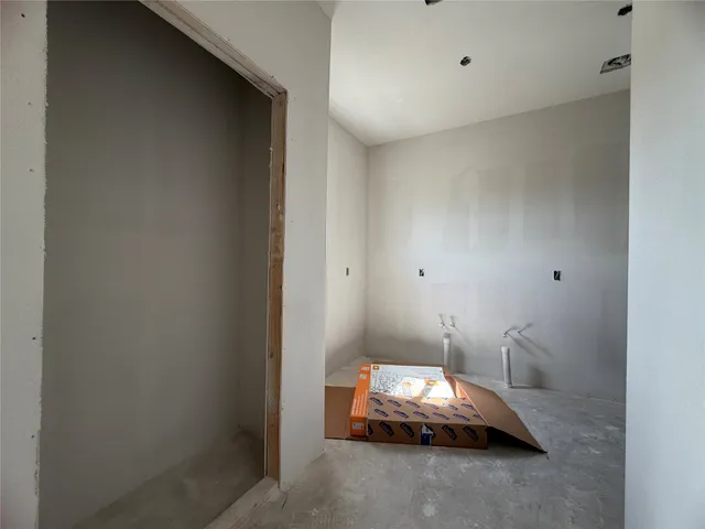 a room with a bed and a mirror