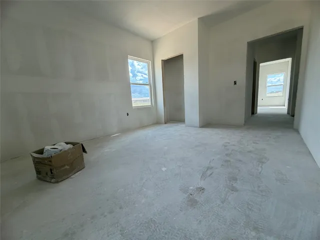 a living room with furniture and window