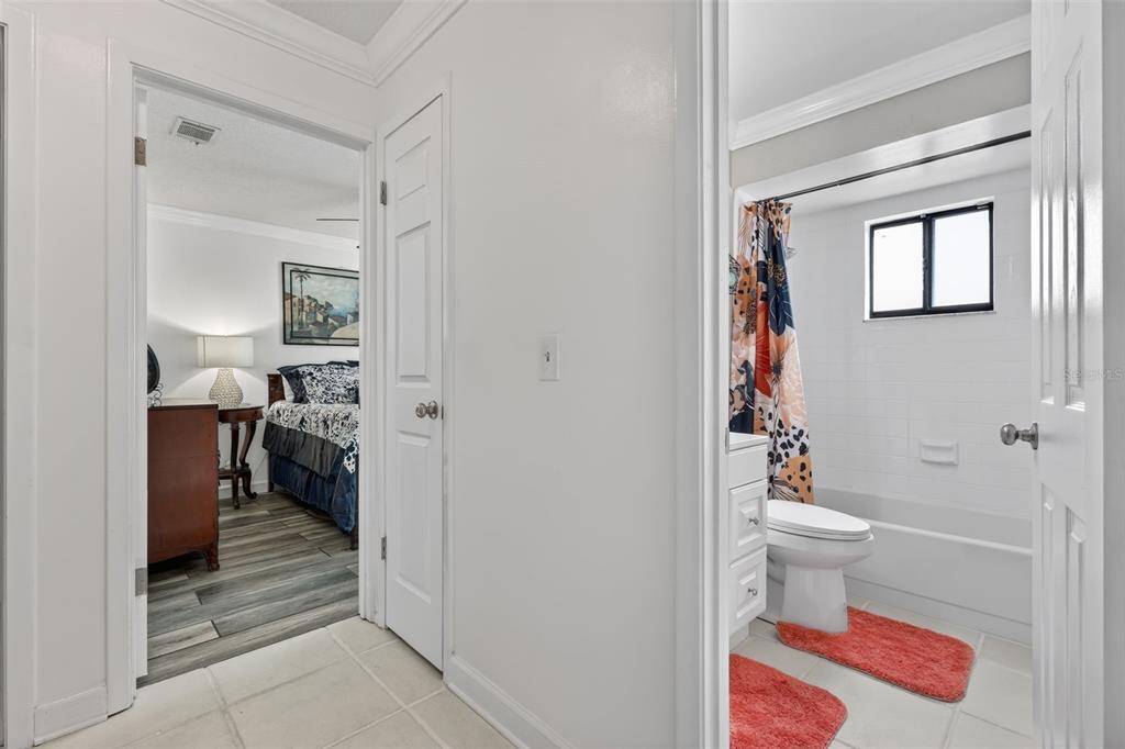 575 Tiberon Cove Road Longwood, FL 32750 - Photo 24 of 56 a bathroom with a toilet and a shower curtain