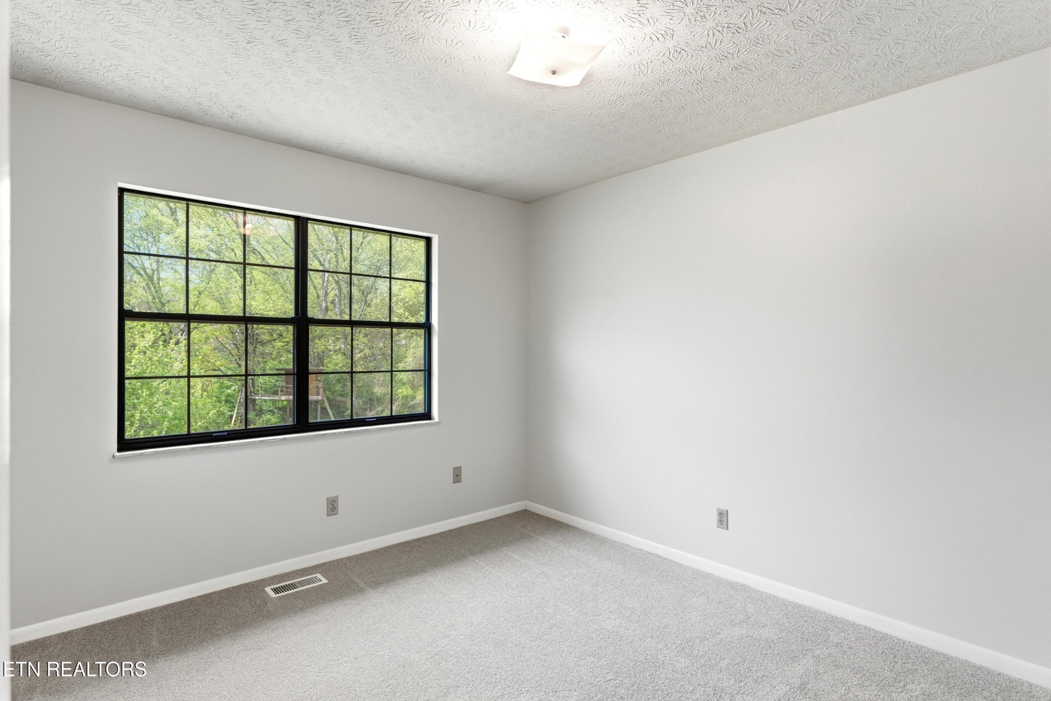 1835 Wilson Road Lenoir City, TN 37772 - Photo 14 of 57 an empty room with a window