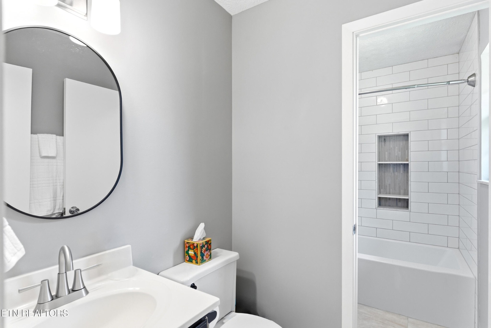 1835 Wilson Road Lenoir City, TN 37772 - Photo 17 of 57 a bathroom with a sink and a mirror