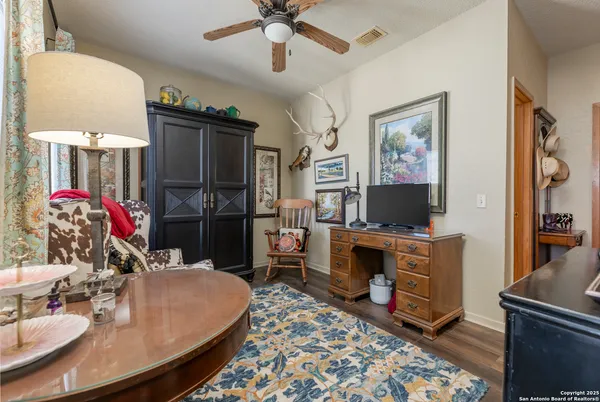 a room with furniture and a flat screen tv
