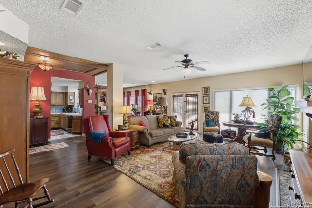 a living room with furniture or couch and a dining table