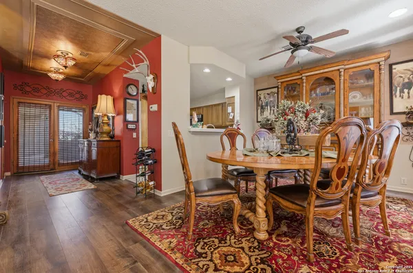 a view of a dining room with furniture window and wooden floor
