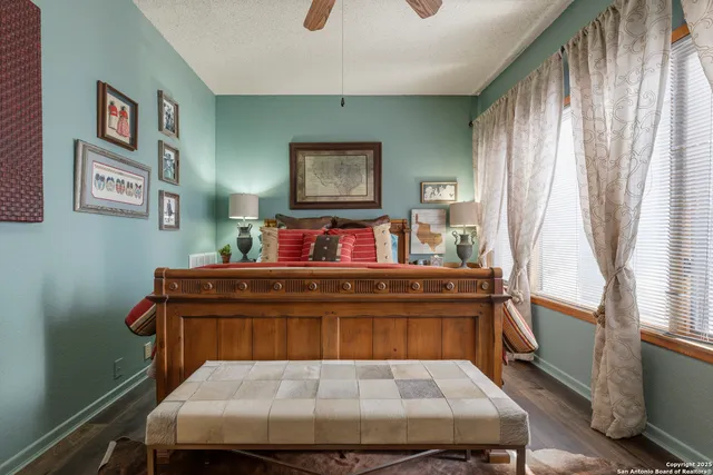 a bedroom with a bed and window