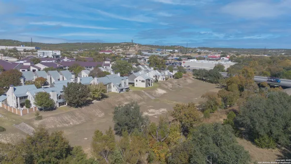 an aerial view of residential building and green space