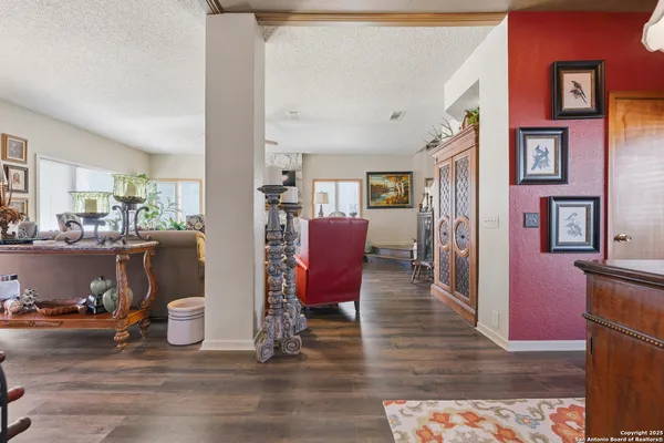 a view of a dining room with furniture and wooden floor