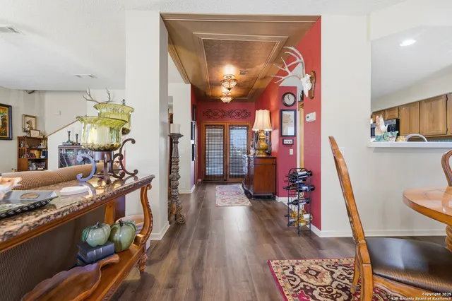 a view of a living room and a wooden floor